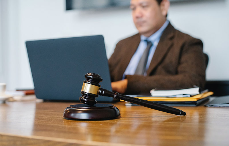 man-with-computer-gavel-business-dispute-law business dispute litigation greensboro nc